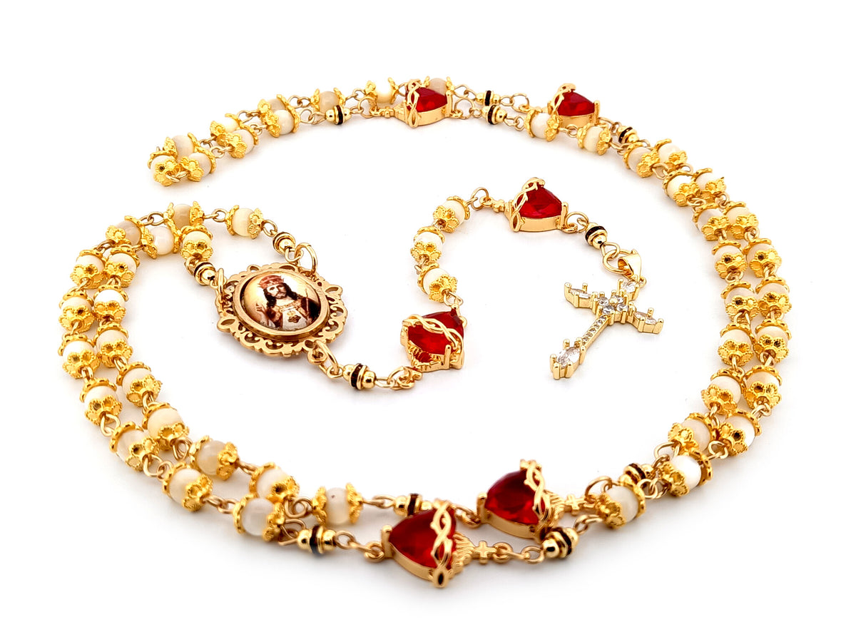Christ the King mother of pearl and red crystal unique rosary beads with 18K gold plated cubic zirconia cross.