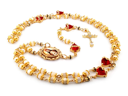 Christ the King mother of pearl and red crystal unique rosary beads with 18K gold plated cubic zirconia cross.