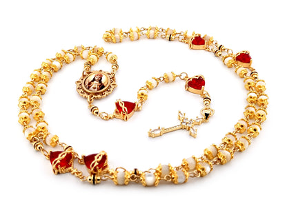 Christ the King mother of pearl and red crystal unique rosary beads with 18K gold plated cubic zirconia cross.