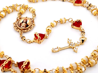 Christ the King mother of pearl and red crystal unique rosary beads with 18K gold plated cubic zirconia cross.