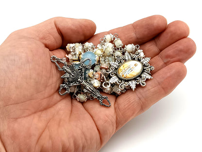 Immaculate Conception mother of pearl and blue glass unique rosary beads with Holy Spirit crucifix.