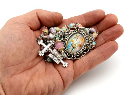 The Presentation of Jesus rainbow agate gemstone and cats eye glass unique rosary beads with two angels crucifix.