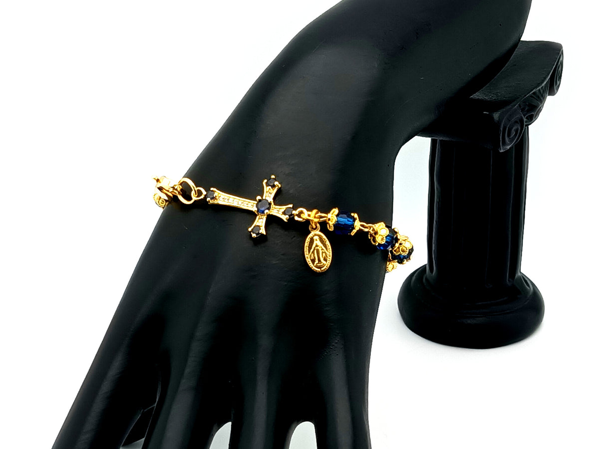 Miraculous medal blue Preciosa crystal single decade rosary bead bracelet with 18ct gold cubic zirconia cross.