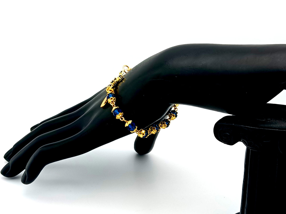 Miraculous medal blue Preciosa crystal single decade rosary bead bracelet with 18ct gold cubic zirconia cross.