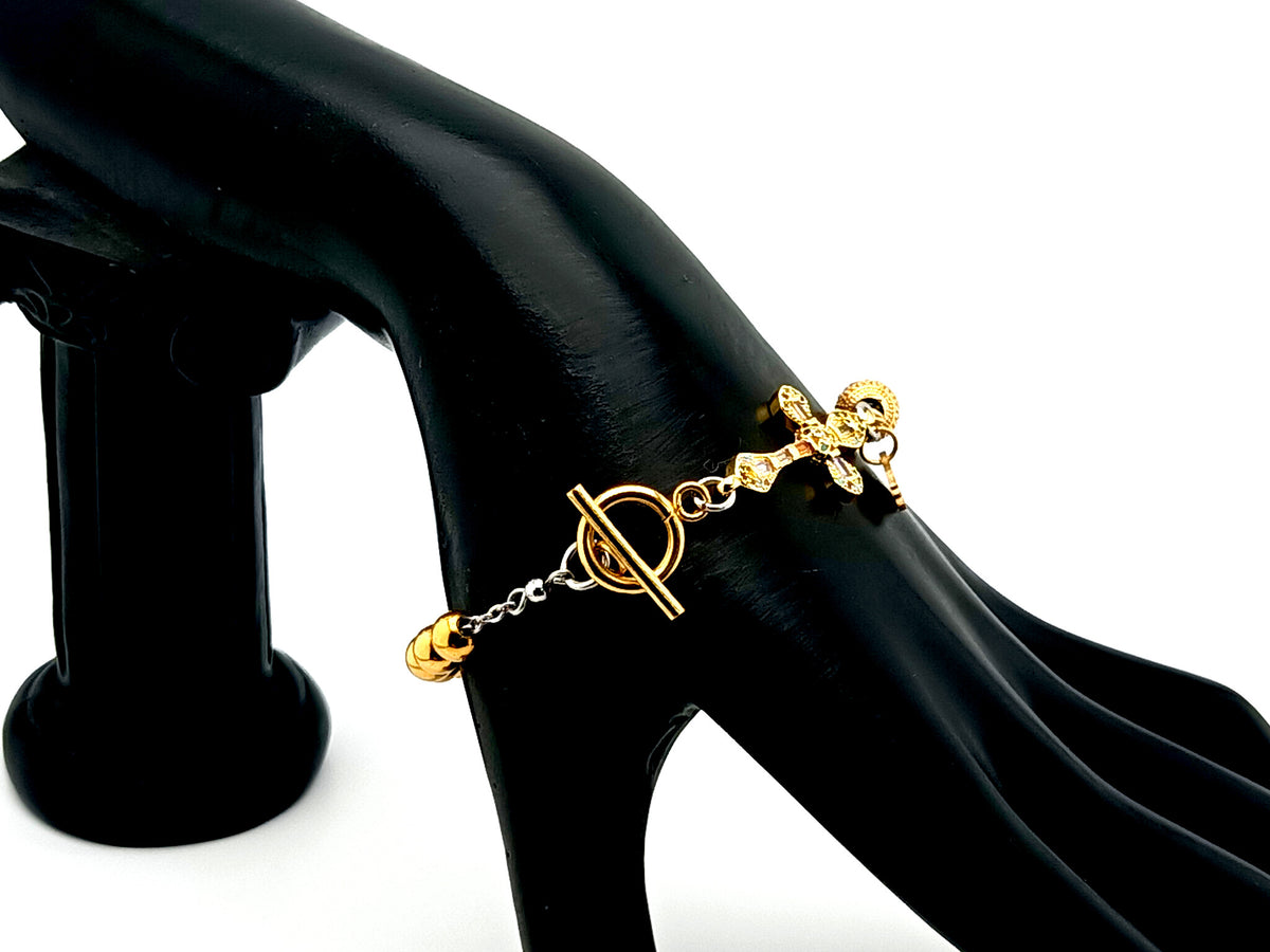Holy Spirit gold plated stainless steel single decade rosary bead bracelet with 18K cubic zirconia cross. 