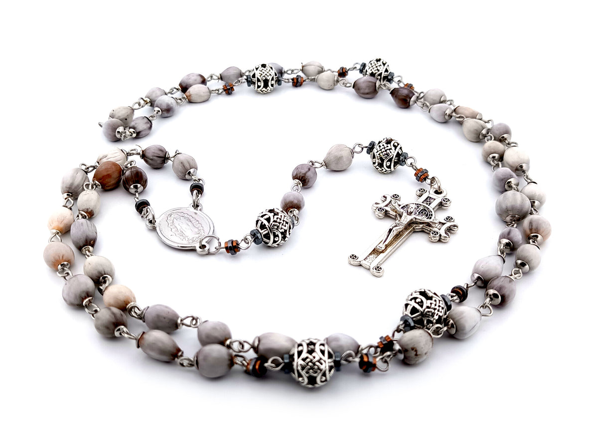 Our Lady of Guadalupe Jobs tears and silver unique rosary beads with Saint Benedict crucifix.