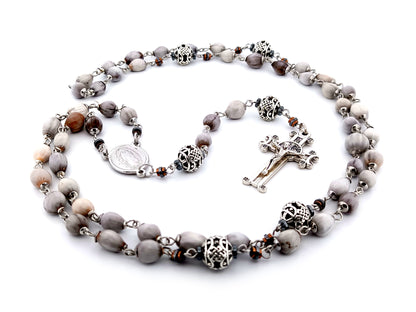 Our Lady of Guadalupe Jobs tears and silver unique rosary beads with Saint Benedict crucifix.
