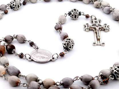 Our Lady of Guadalupe Jobs tears and silver unique rosary beads with Saint Benedict crucifix.