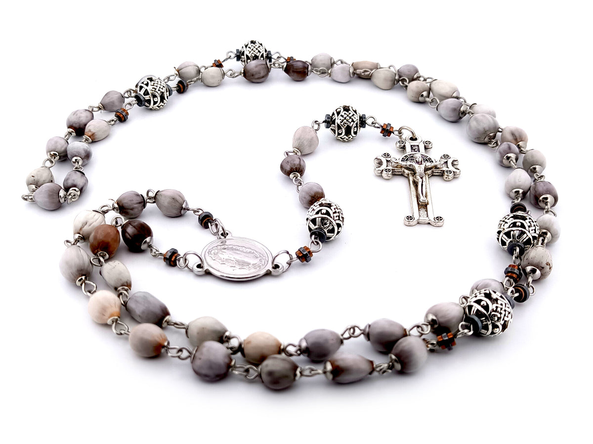 Our Lady of Guadalupe Jobs tears and silver unique rosary beads with Saint Benedict crucifix.