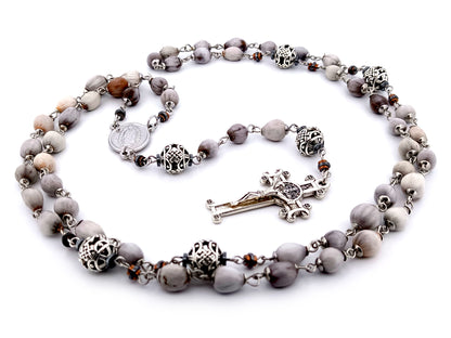 Our Lady of Guadalupe Jobs tears and silver unique rosary beads with Saint Benedict crucifix.