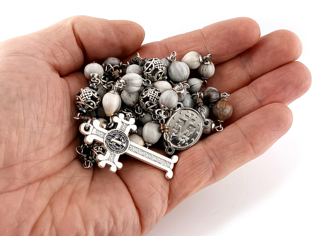 Our Lady of Guadalupe Jobs tears and silver unique rosary beads with Saint Benedict crucifix.
