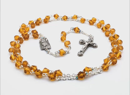 Our Lady of Lourdes and Saint Bernadette amber glass rosary.