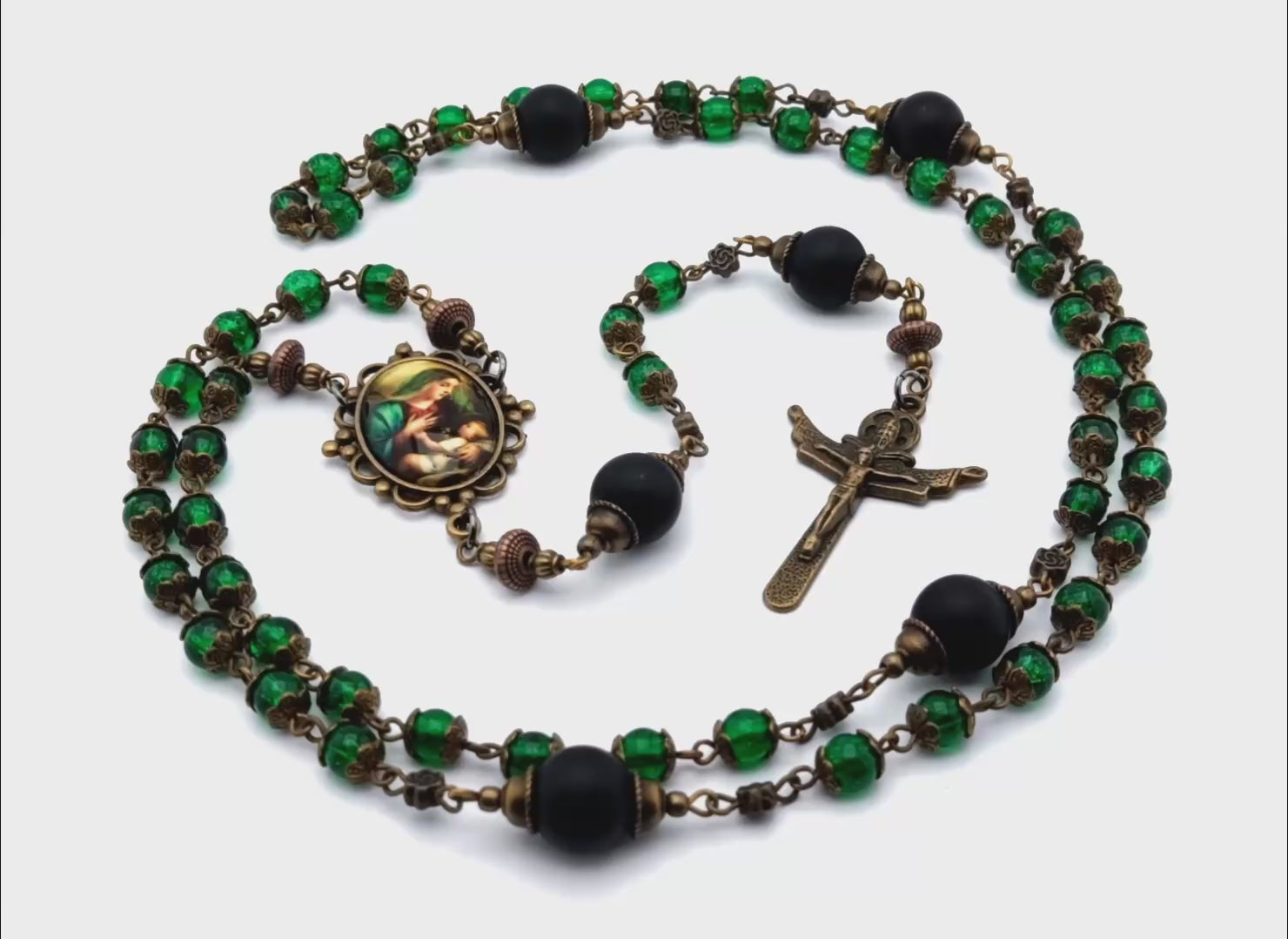 Virgin Mother and child unique rosary beads with green glass and black matt onyx beads, bronze crucifix and picture centre medal.