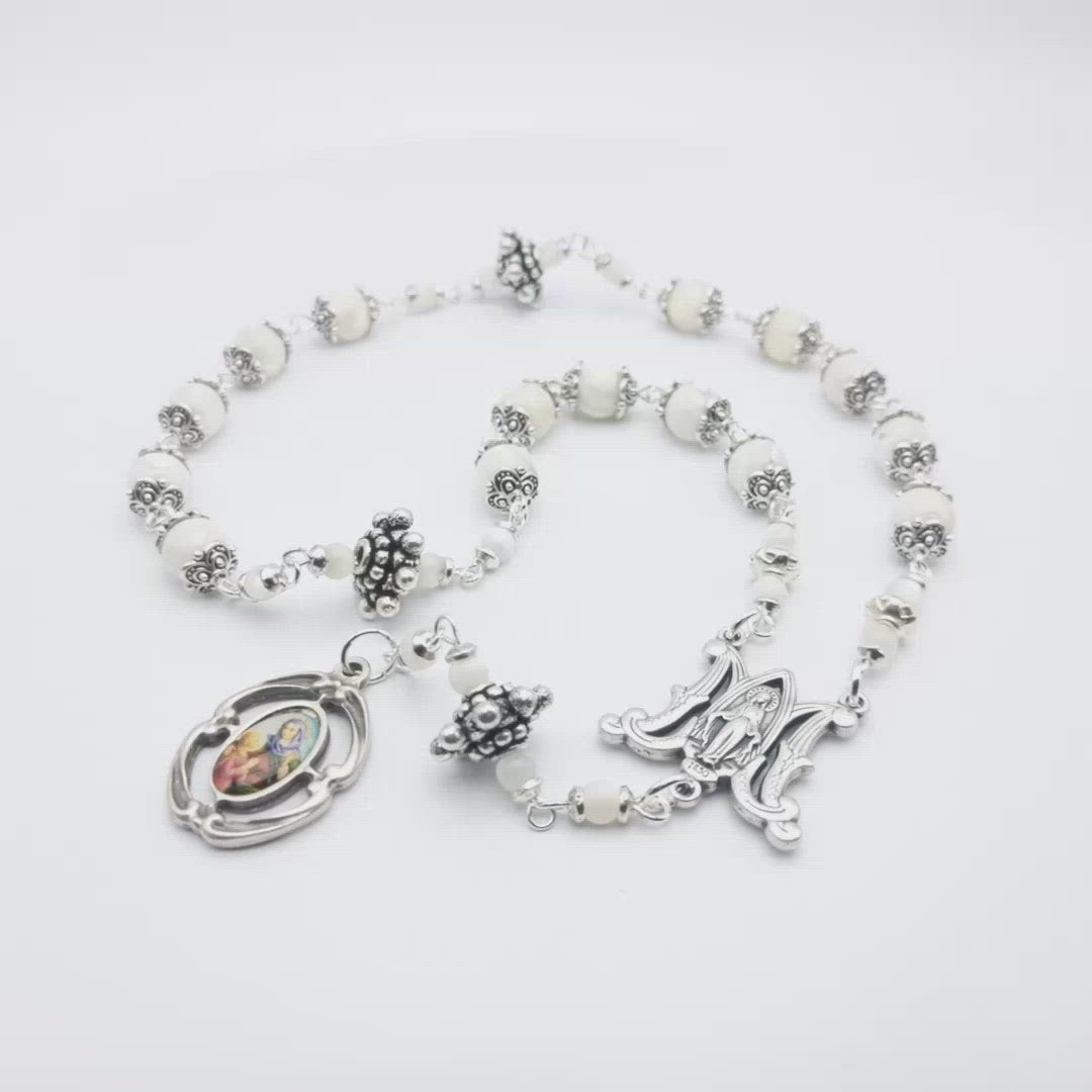 Saint Ann unique rosary beads prayer chaplet, with mother of pearl beads, silver picture medal, bead caps and miraculous medal centre.