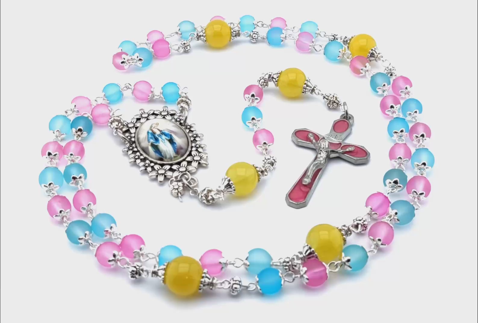 Immaculate Conception unique rosary beads with mixed colour glass beads, pink enamel crucifix and silver picture centre medal and accessories.