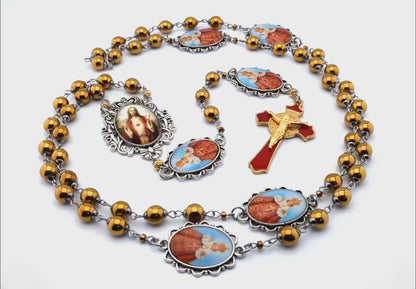 Infant of Prague unique rosary beads with gold hematite gemstone beads, Infant of Prague pater beads, gold and red enamel crucifix and silver picture centre medal.