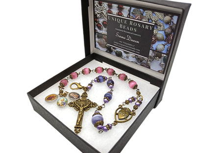 Pocket servite unique dolor rosary in pink and blue glass beads and bronze crucifix and medal.
