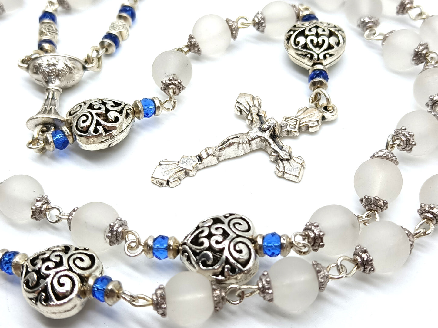 Childs unique rosary beads with white glass beads and silver crucifix and centre medal.