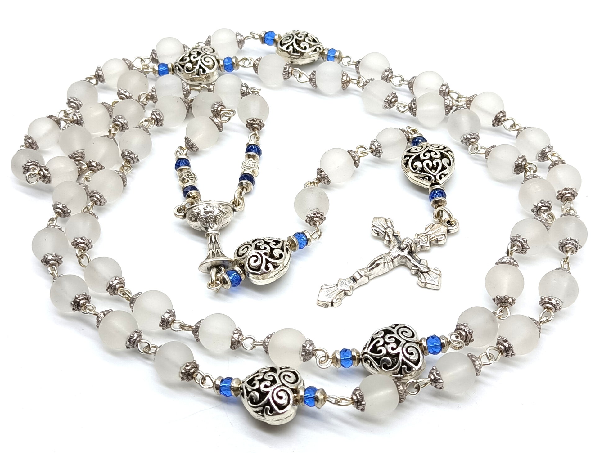 Childs unique rosary beads with white glass beads and silver crucifix and centre medal.