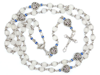 Childs unique rosary beads with white glass beads and silver crucifix and centre medal.