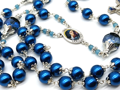 Our Lady of Sorrows unique rosary beads with blue glass beads, blue enamel crucifix and silver centre medal.