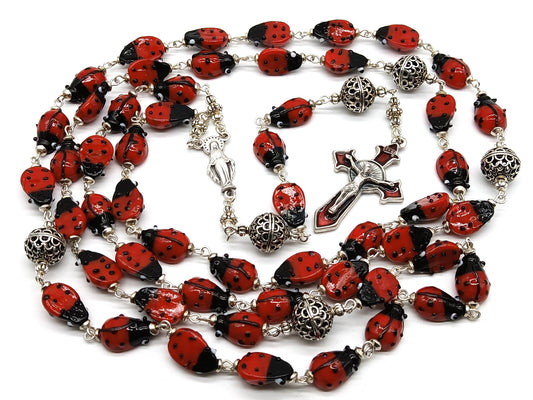 Lady Bug unique rosary beads with glass lady bird beads and red enamel crucifix and silver centre medal.