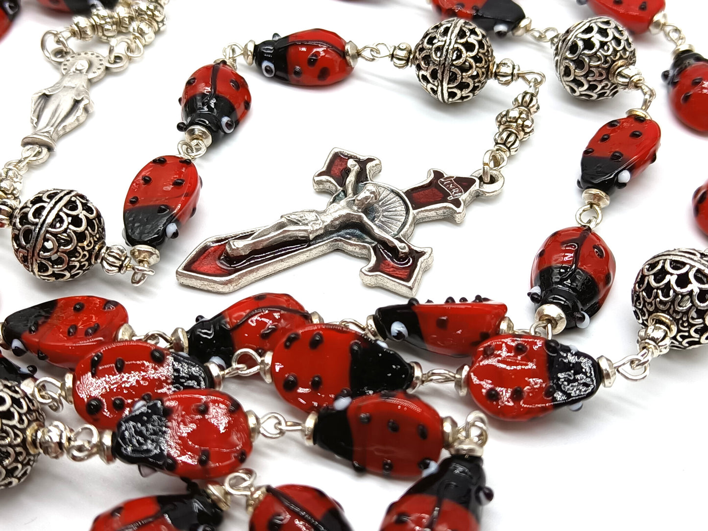 Lady Bug unique rosary beads with glass lady bird beads and red enamel crucifix and silver centre medal.