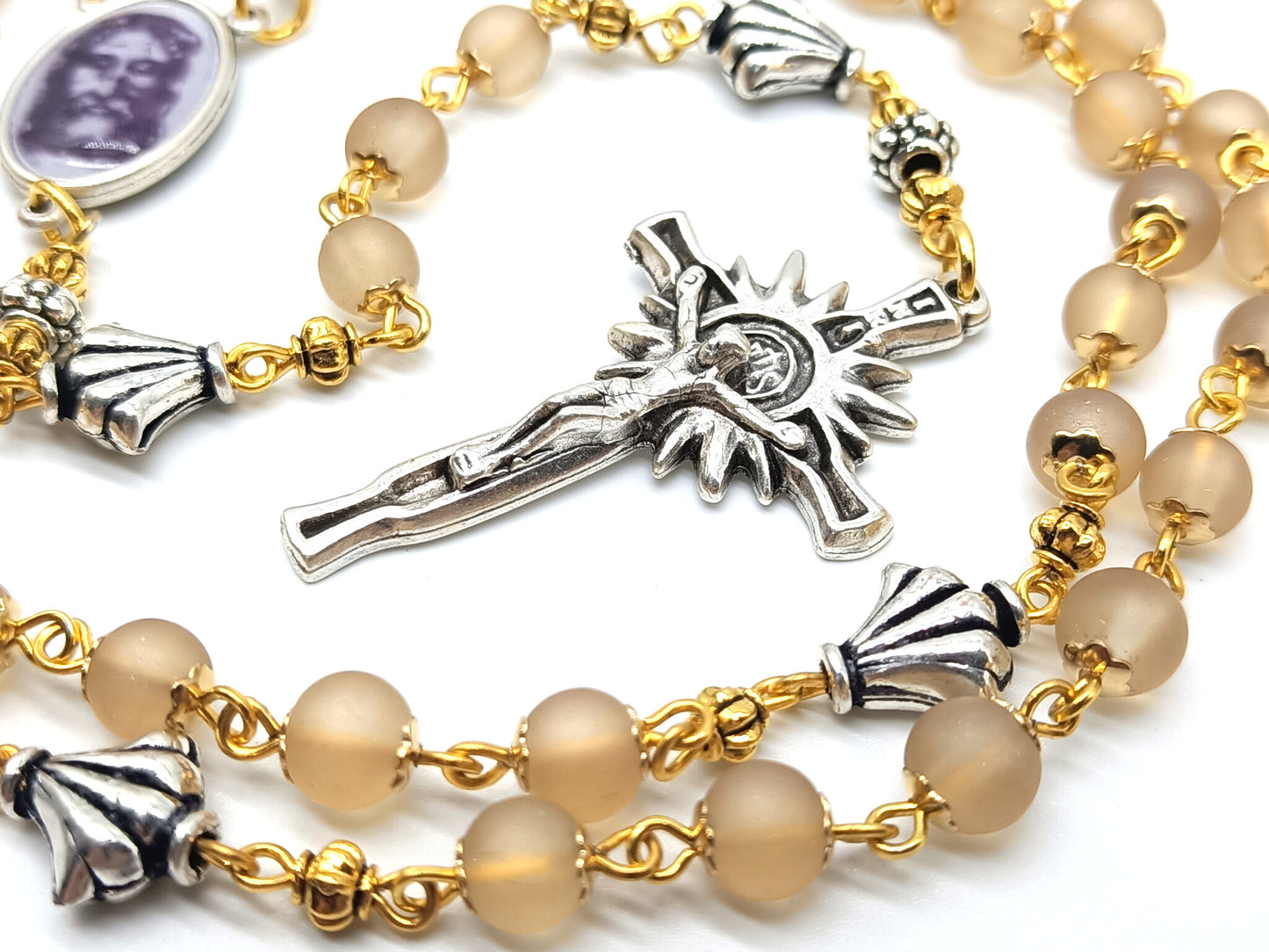 The Holy Face of Jesus rosary beads with pale gold glass beads and silver crucifix and centre medal.