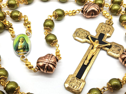 Green glass rosary with copper, gold and black crucifix and Our Lady of Sorrows medal.