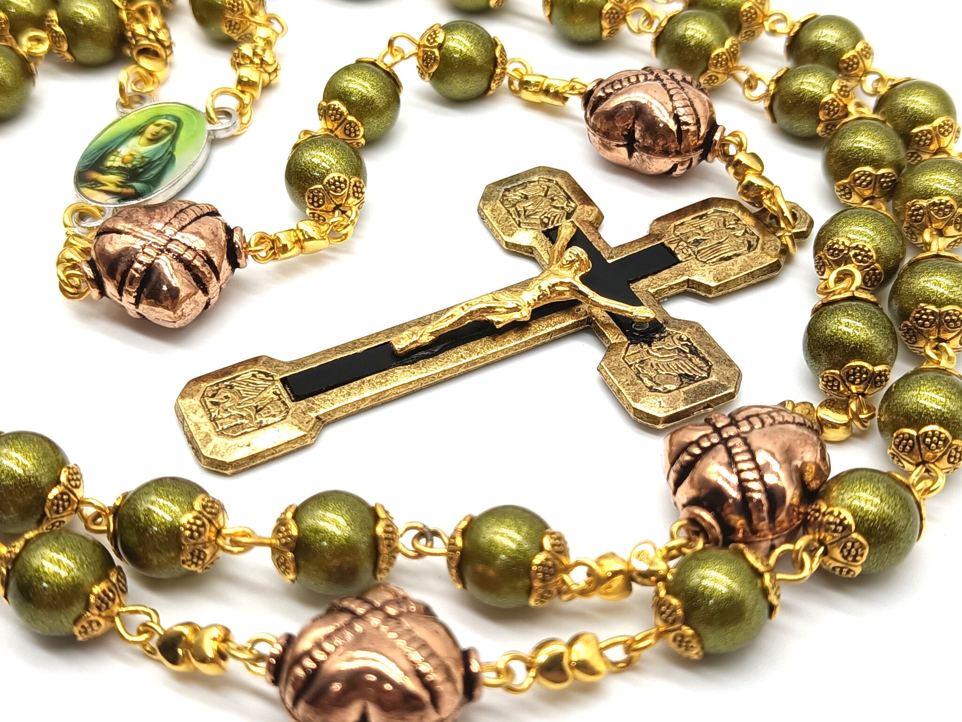 Green glass rosary with copper, gold and black crucifix and Our Lady of Sorrows medal.