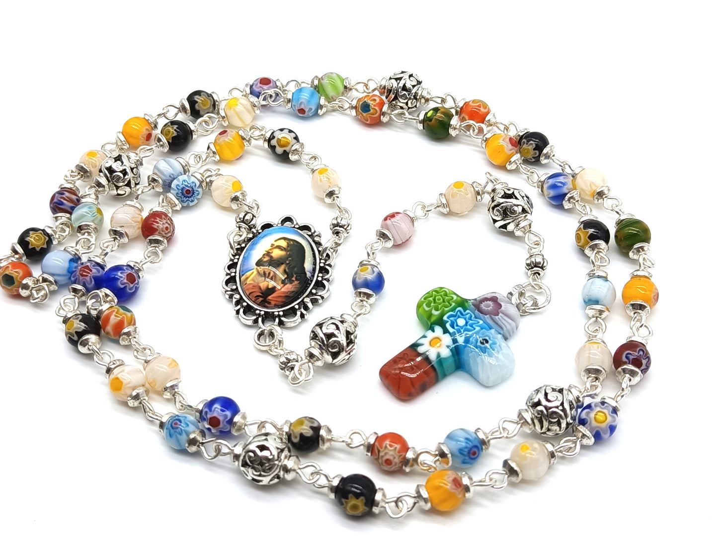 Millefiori glass unique rosary beads with Jesus face centre medal, silver pater beads and millefiori crucifix.