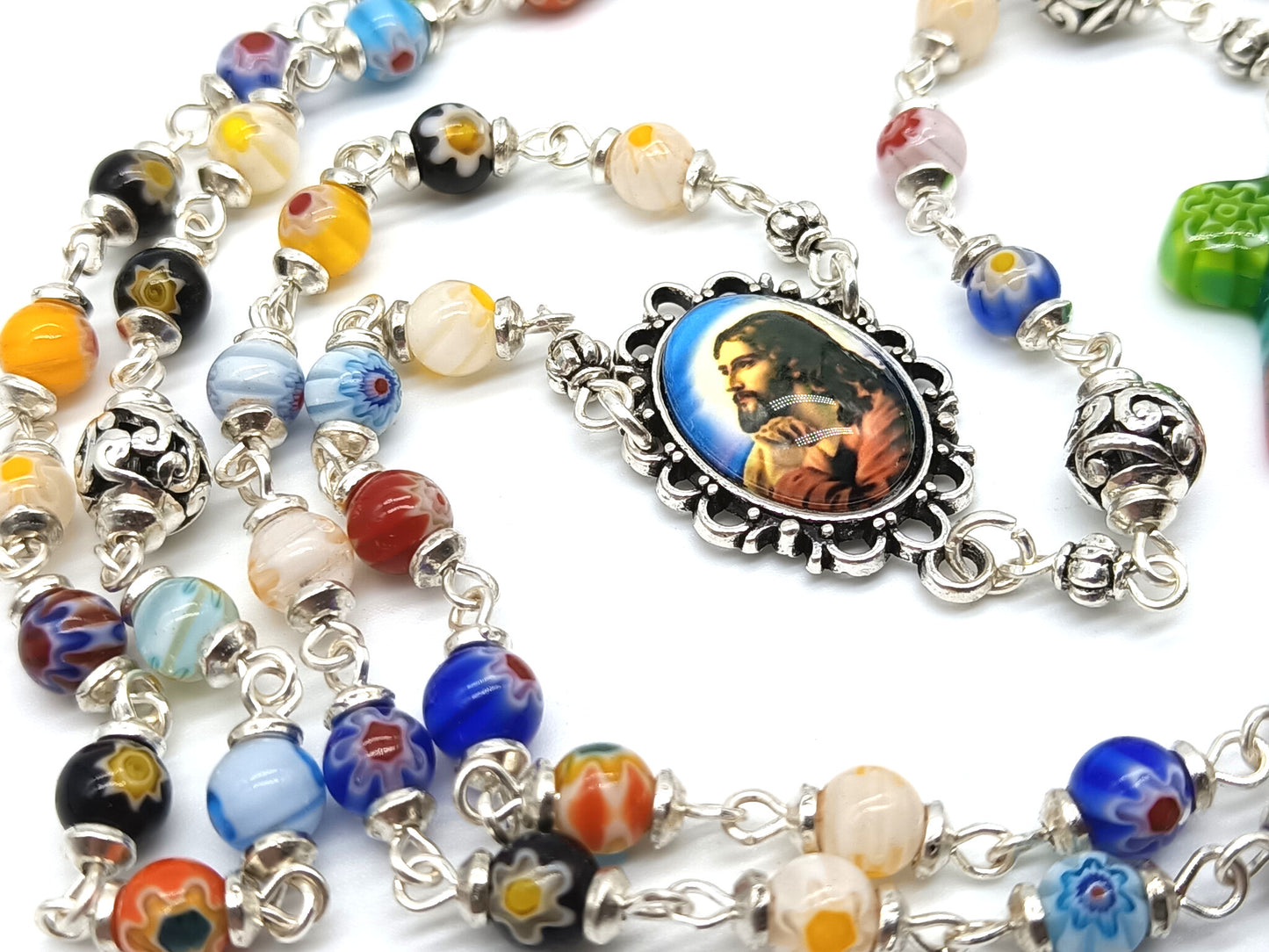 Millefiori glass unique rosary beads with Jesus face centre medal, silver pater beads and millefiori crucifix.