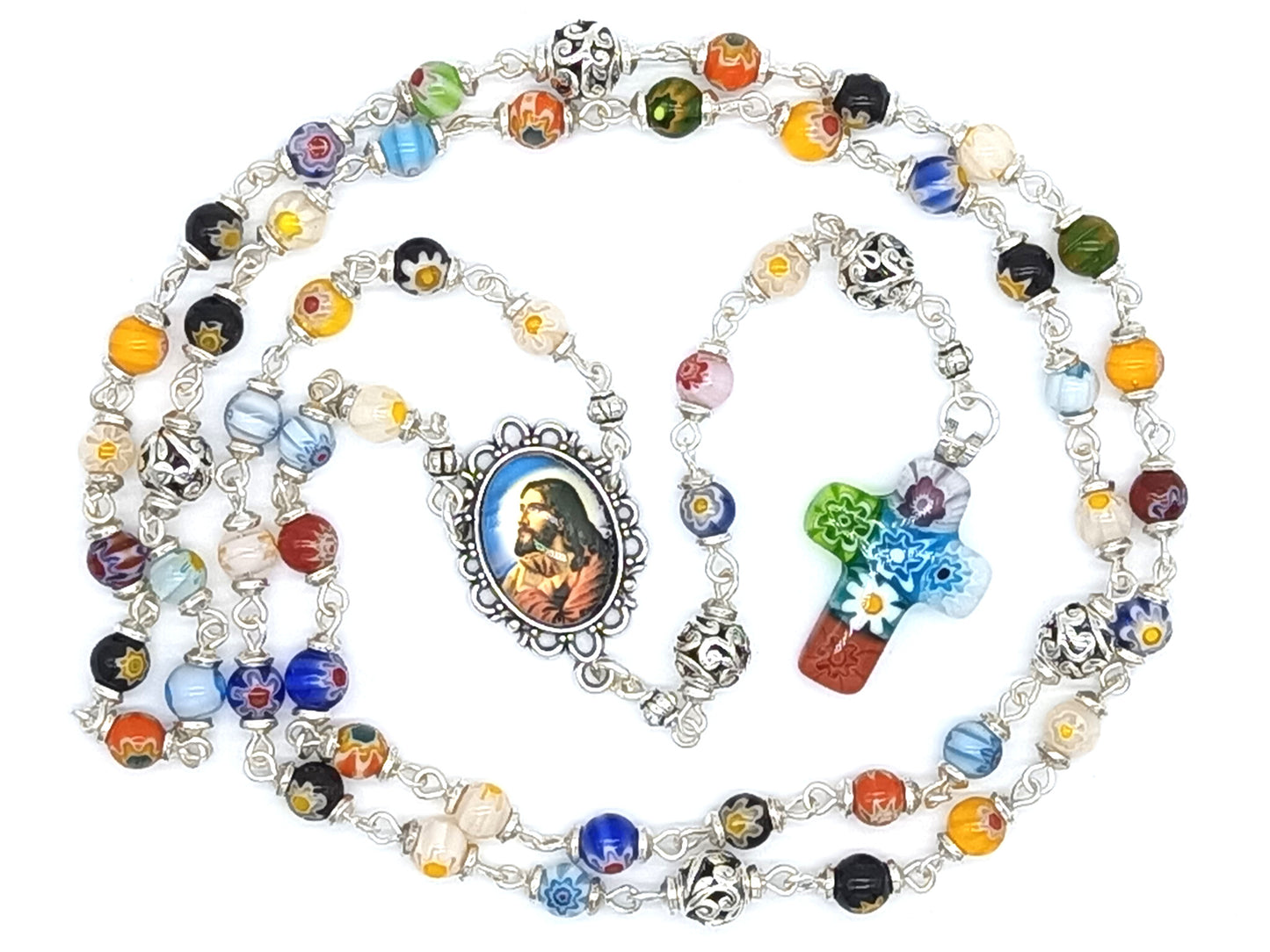 Millefiori glass unique rosary beads with Jesus face centre medal, silver pater beads and millefiori crucifix.