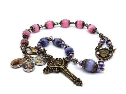 Pocket servite unique dolor rosary in pink and blue glass beads and bronze crucifix and medal.