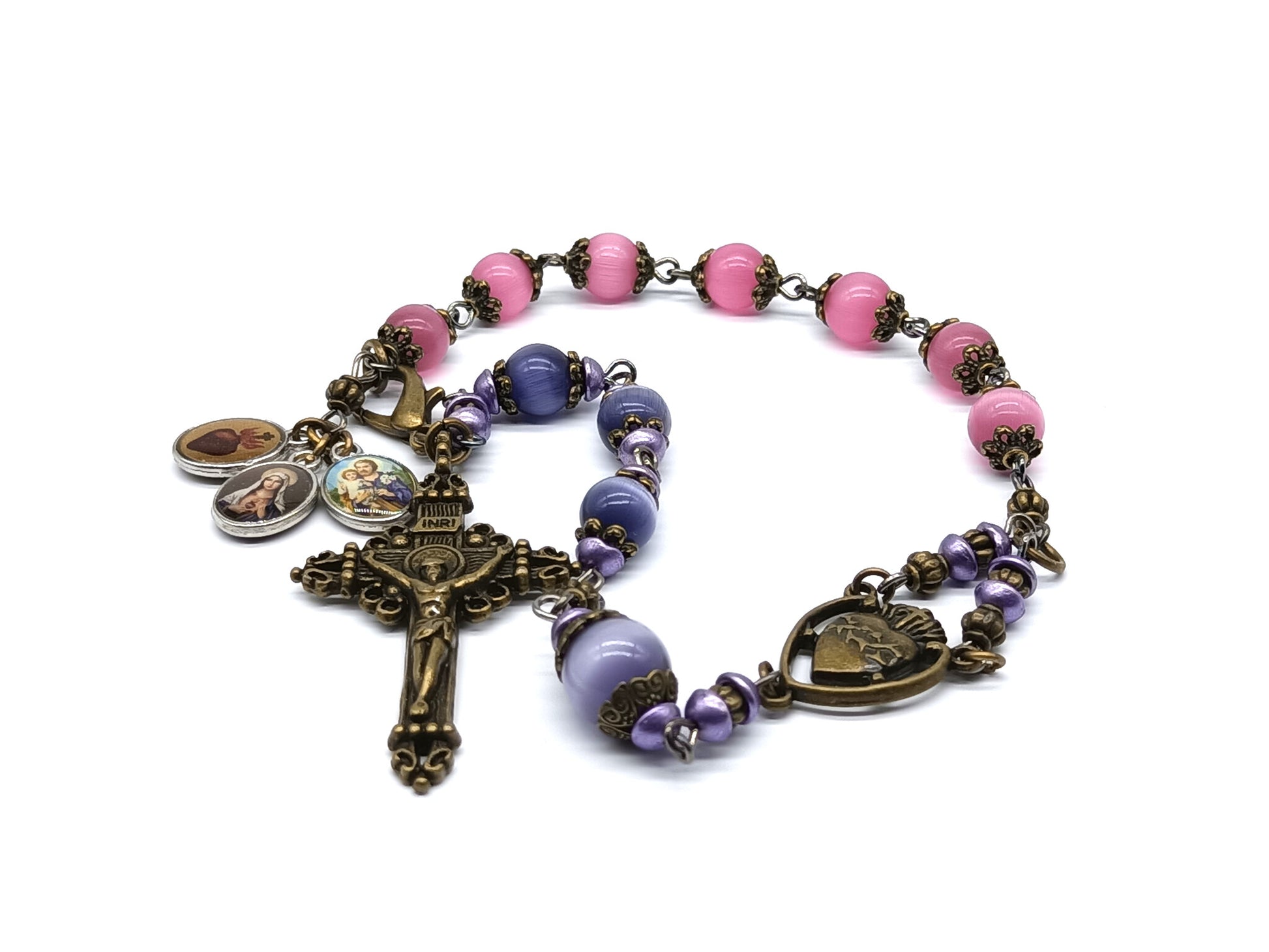 Pocket servite unique dolor rosary in pink and blue glass beads and bronze crucifix and medal.