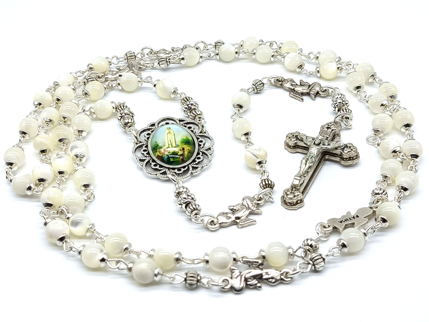 Mother of Pearl Fatima unique rosary beads with silver angel pater beads, crucifix and picture centre medal.