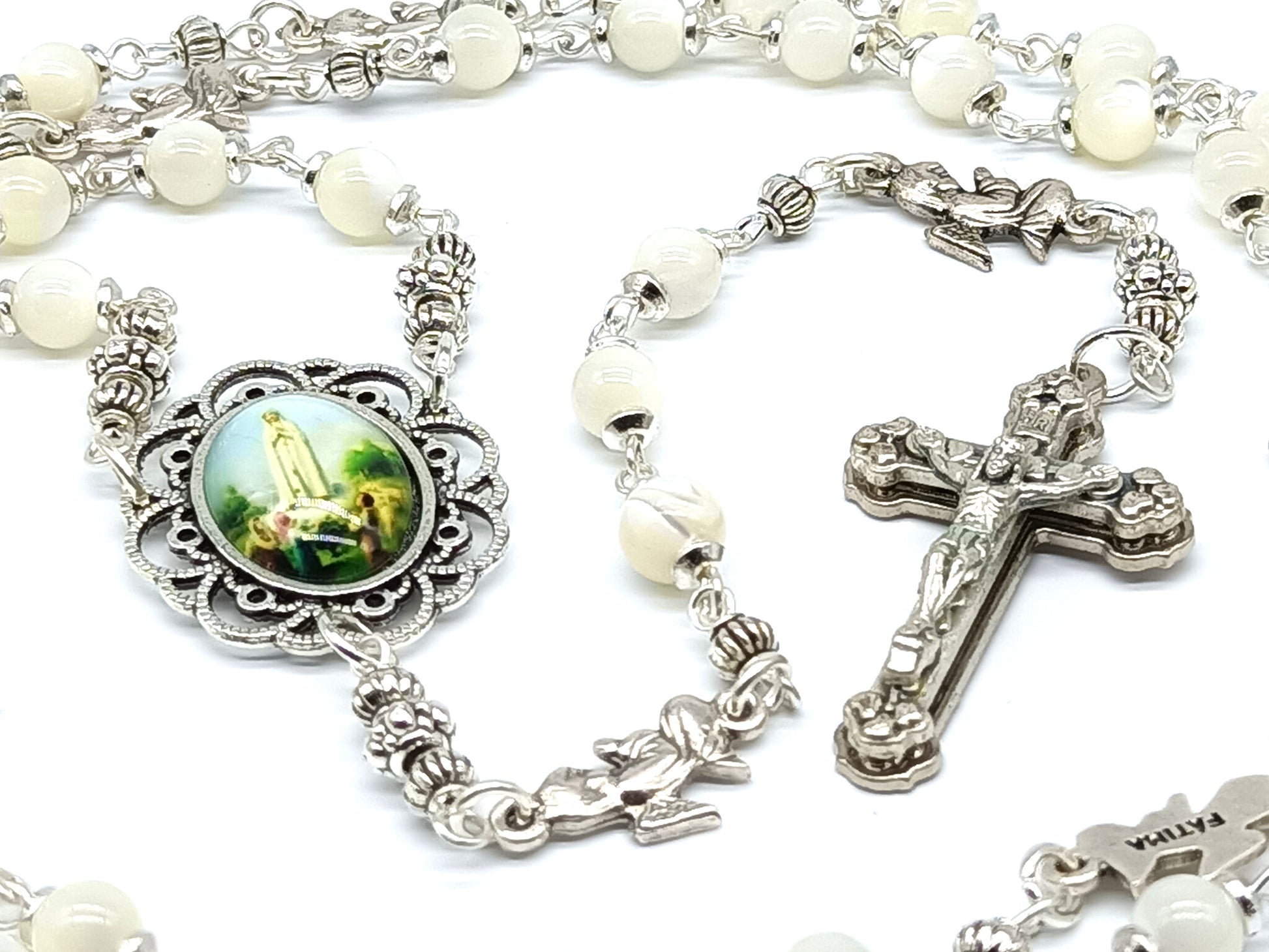 Mother of Pearl Fatima unique rosary beads with silver angel pater beads, crucifix and picture centre medal.