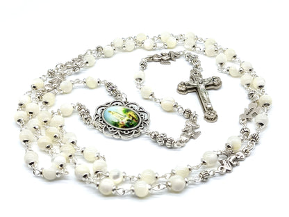 Mother of Pearl Fatima unique rosary beads with silver angel pater beads, crucifix and picture centre medal.