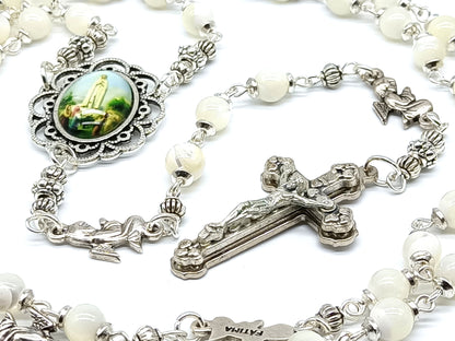 Mother of Pearl Fatima unique rosary beads with silver angel pater beads, crucifix and picture centre medal.