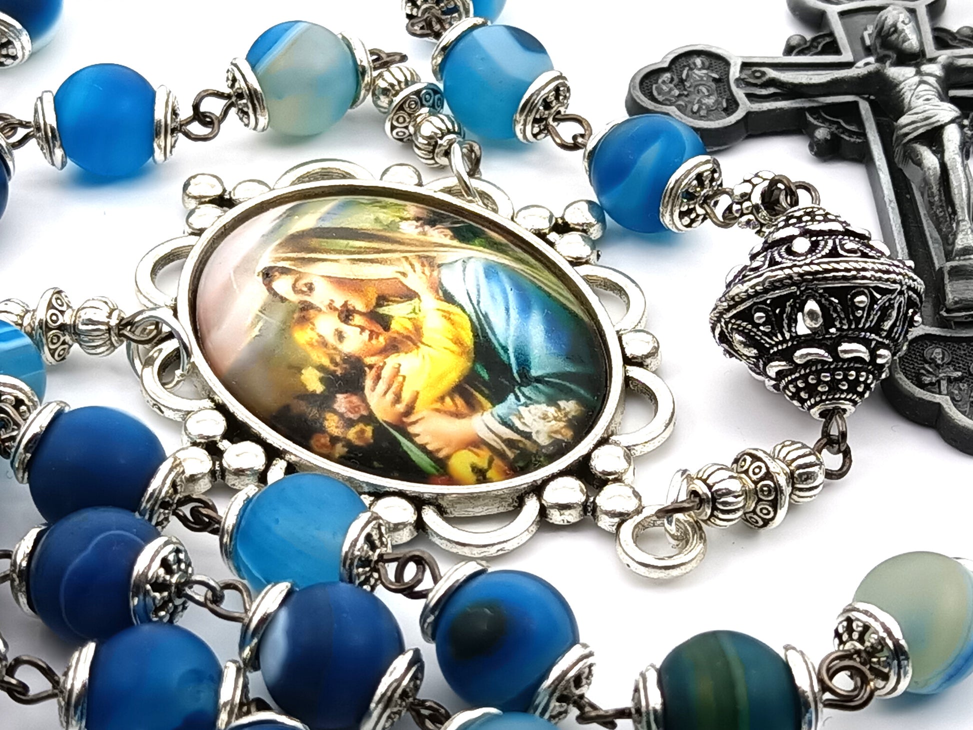 Virgin and Child unique rosary beads with blue gemstone beads, pewter crucifix, silver pater beads, bead caps and picture centre medal.