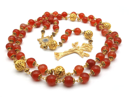 Gold Plated unique rosary beads with flame gemstone beads, gold plated dogwood crucifix, pater beads and centre medal.