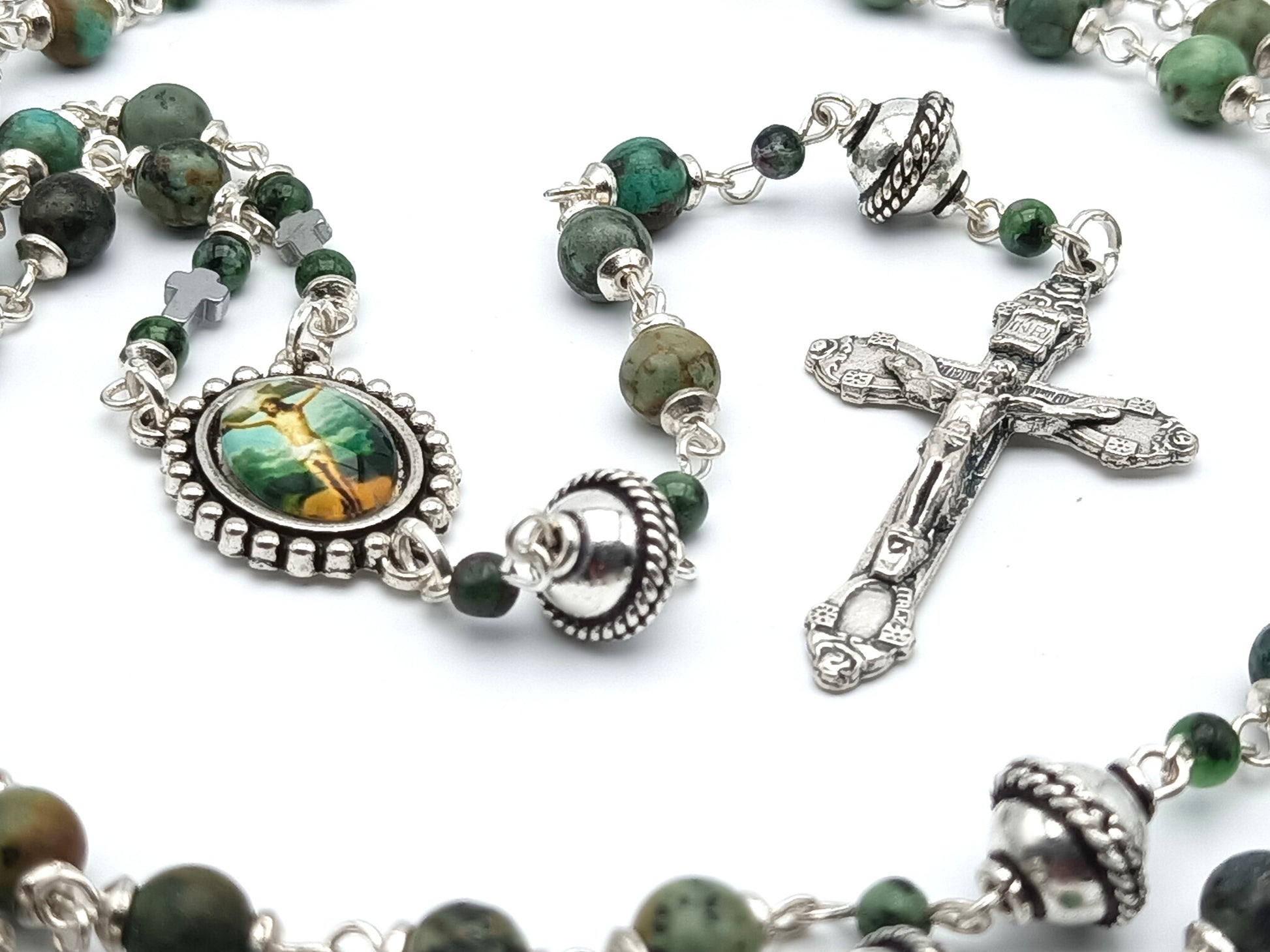 The Crucifixion unique rosary beads with green gemstone beads, silver crucifix, pater beads and picture centre medal.