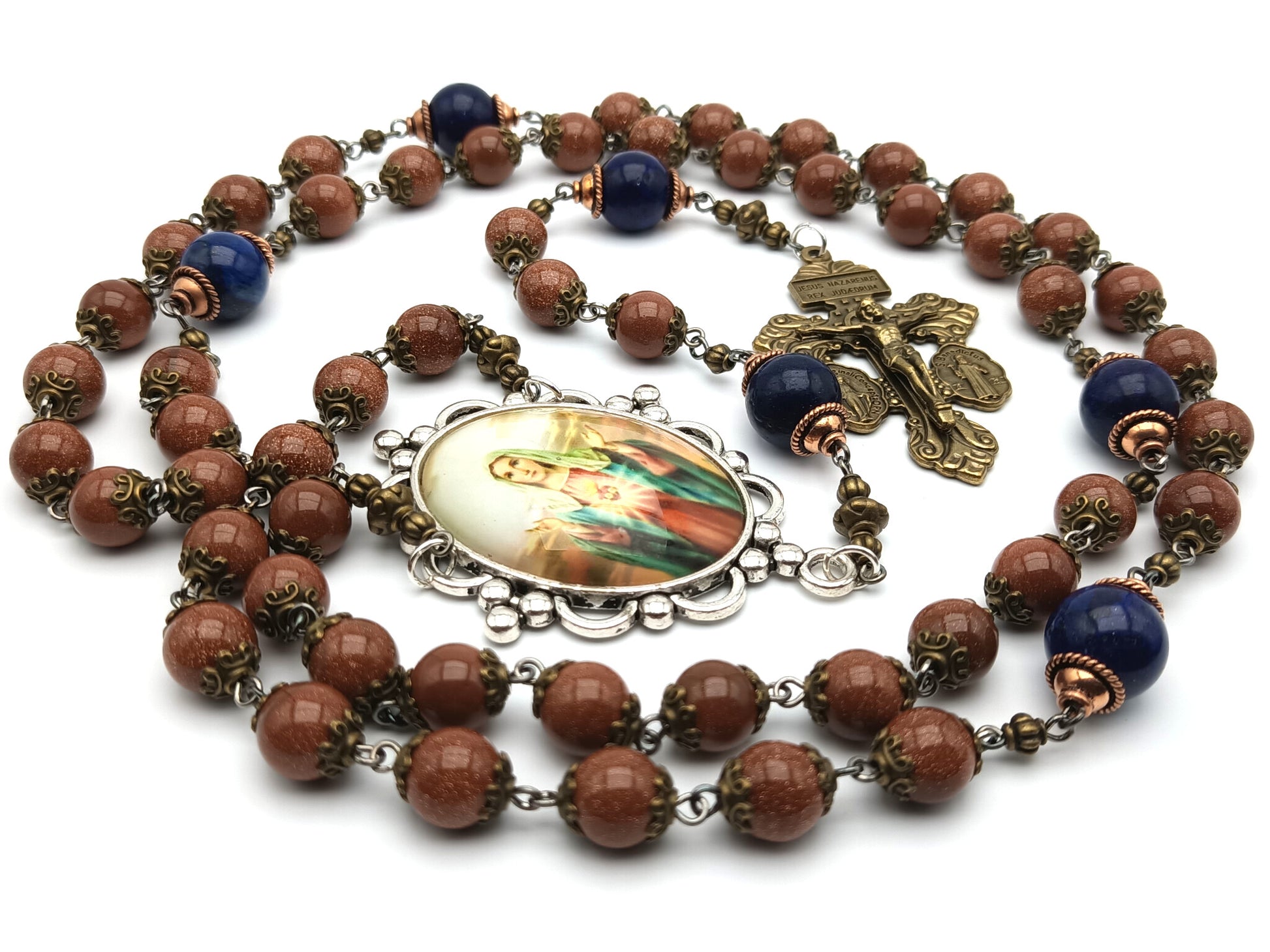 Immaculate Heart unique rosary beads with sparkling rust gemstone beads, blue pater beads, bronze pardon crucifix and silver Our Lady picture centre medal.