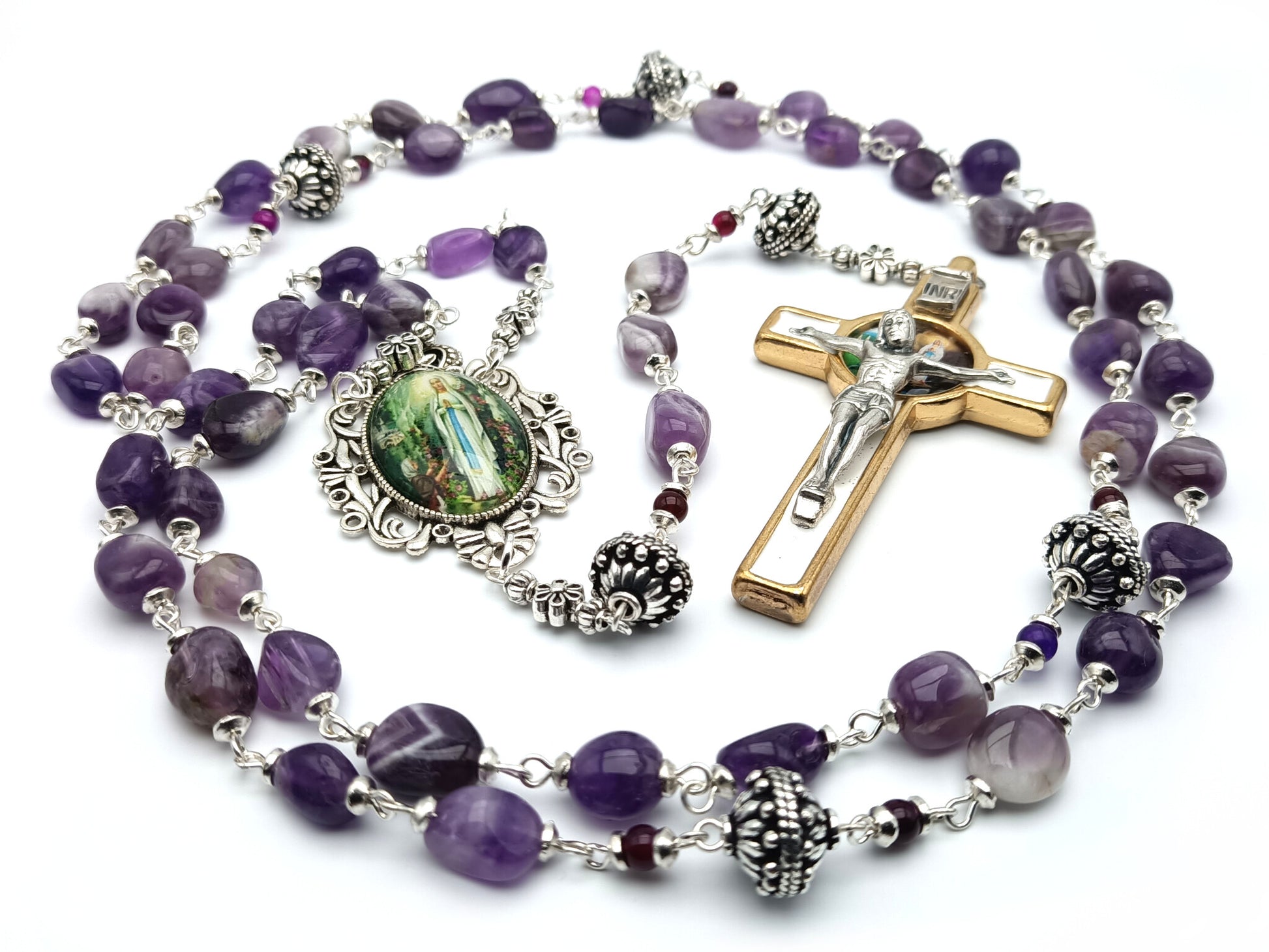 Our Lady of Lourdes unique rosary beads with purple gemstone beads, gold and white enamel crucifix, silver pater beads and picture centre medal.