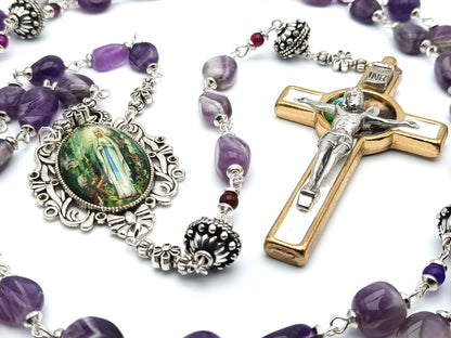 Our Lady of Lourdes unique rosary beads with purple gemstone beads, gold and white enamel crucifix, silver pater beads and picture centre medal.