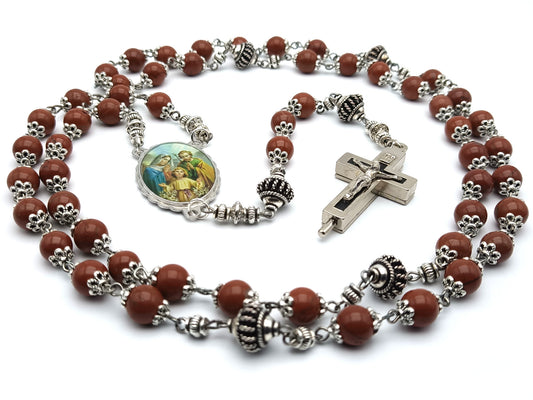 Holy Family unique rosary beads with brown gemstone beads, reliquary crucifix, silver pater beads, and picture centre medal. 