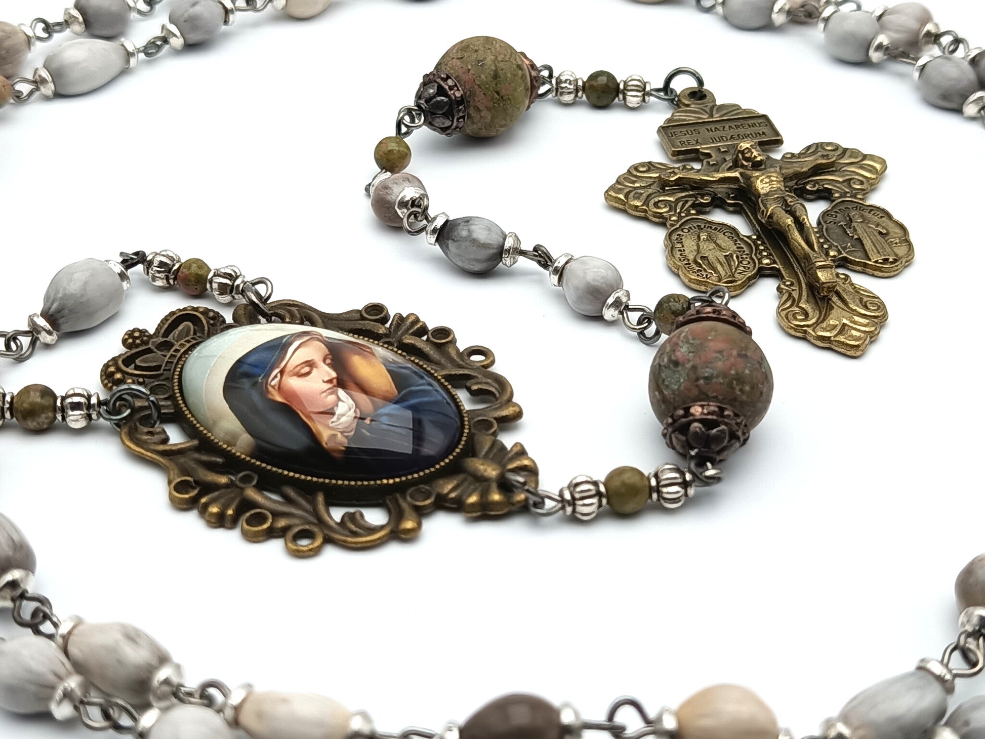Our Lady of Sorrows unique rosary beads with Jobs tears beads, jasper gemstone pater beads, bronze pardon crucifix and picture centre medal.