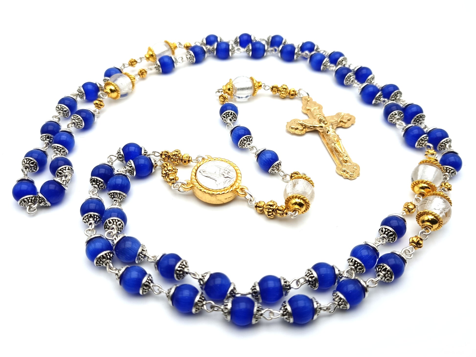 Our Lady of Fatima unique rosary beads with blue and silver foil glass beads, golden crucifix, Fatima centre medal and bead caps.