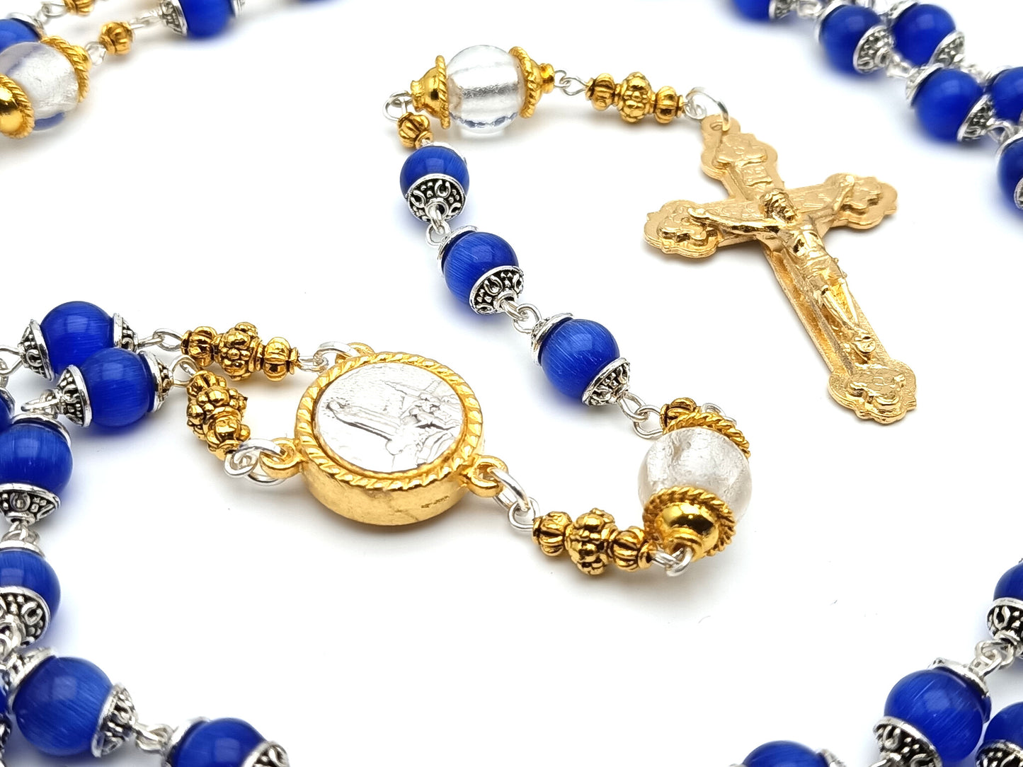 Our Lady of Fatima unique rosary beads with blue and silver foil glass beads, golden crucifix, Fatima centre medal and bead caps.