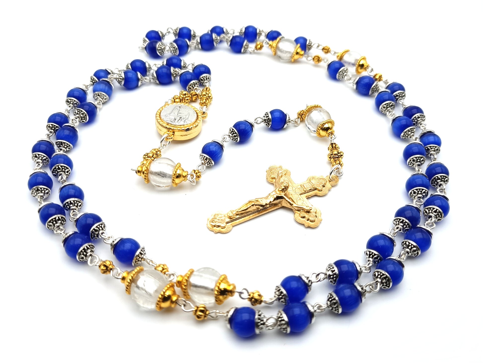 Our Lady of Fatima unique rosary beads with blue and silver foil glass beads, golden crucifix, Fatima centre medal and bead caps.